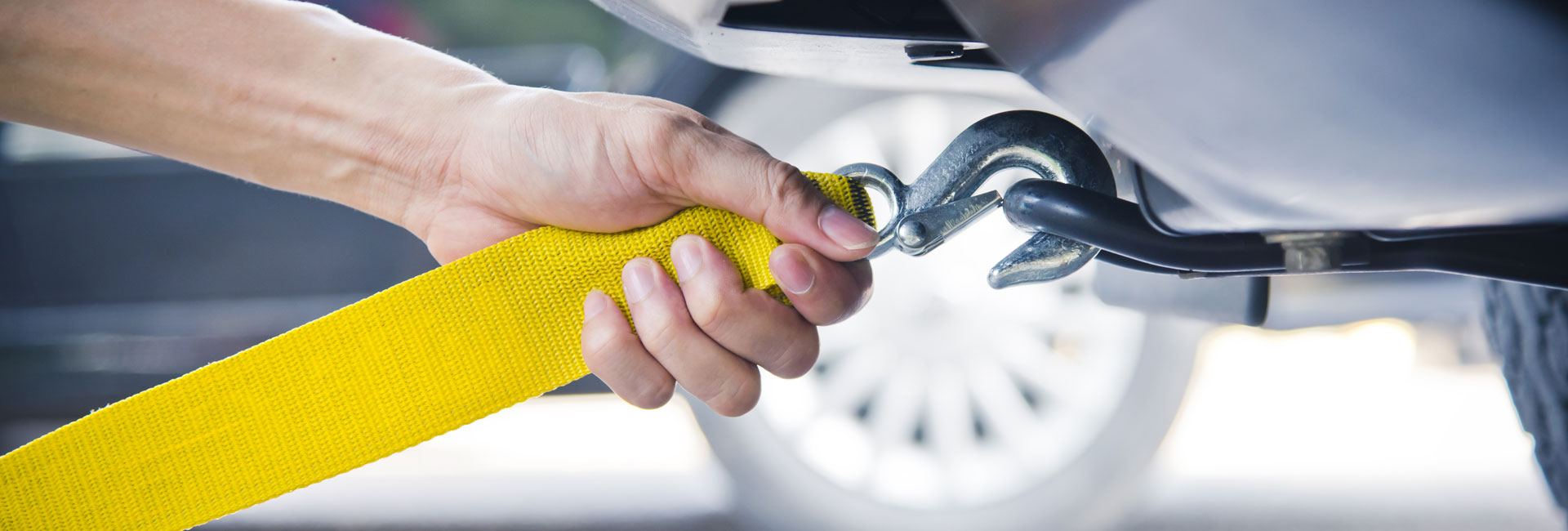 Hand Holding Towing Strap